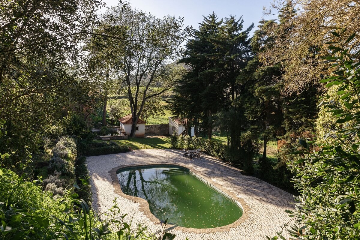 A Renovated Pink Manor House in Portugal 16 garden with pond