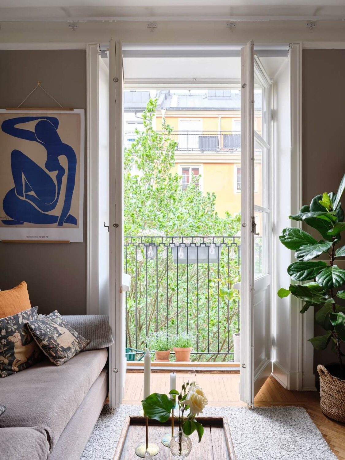 A Small Gray Apartment with Industrial Glass Walls 4 gray living room with balcony