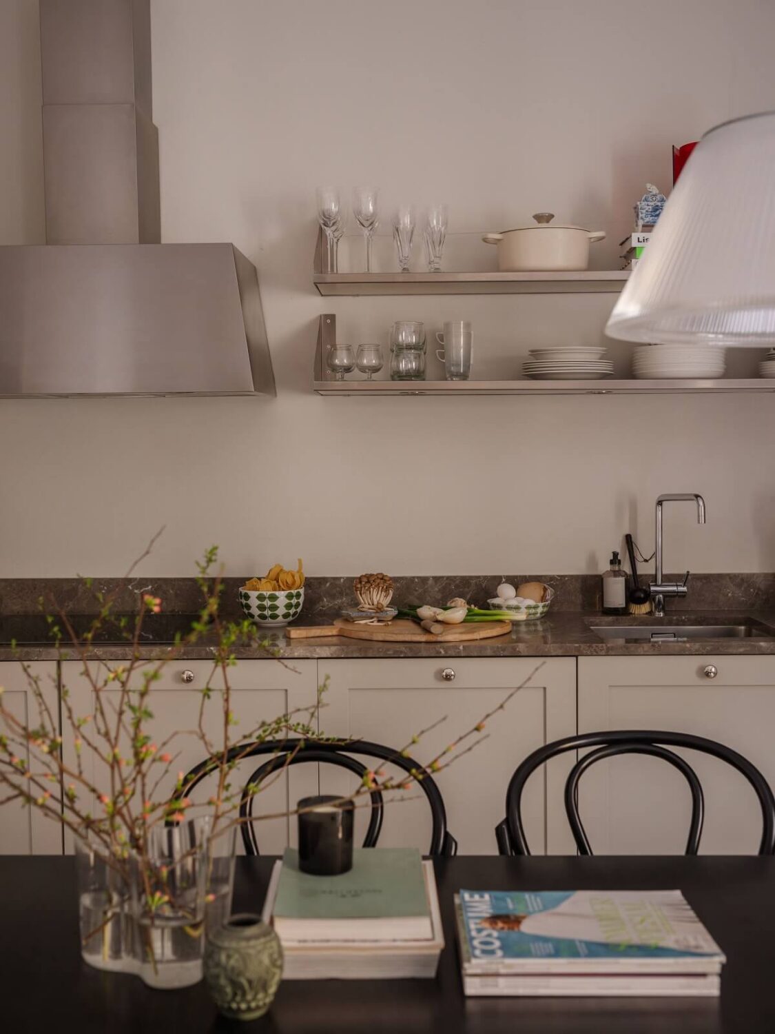 A Muted Color Palette in a Scandinavian Apartment 9 gray scandi kitchen with shelves