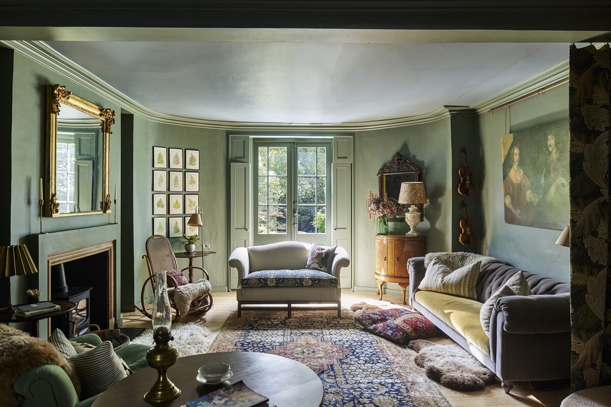 green living room with fireplace in london townhouse