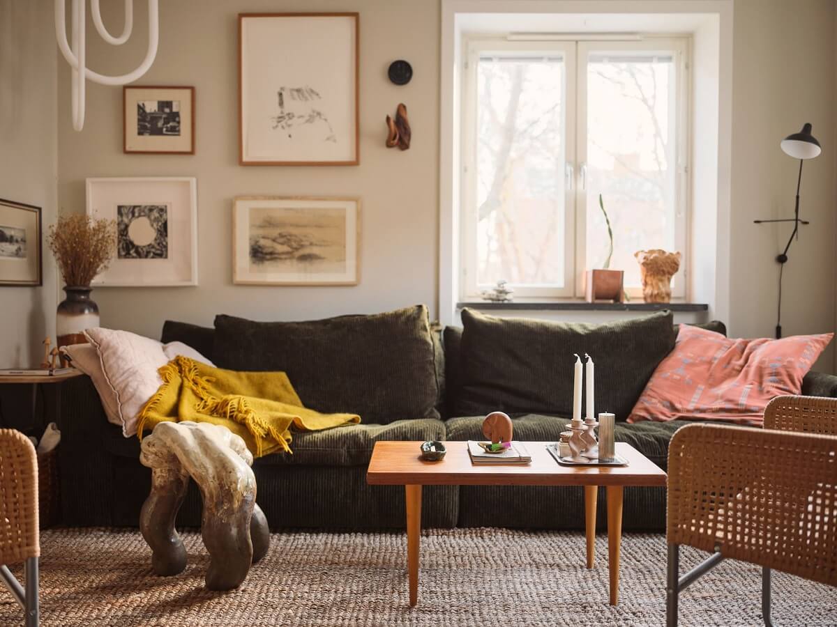 A Small Apartment with a Cozy Dining Nook 2 green sofa in scandi living room