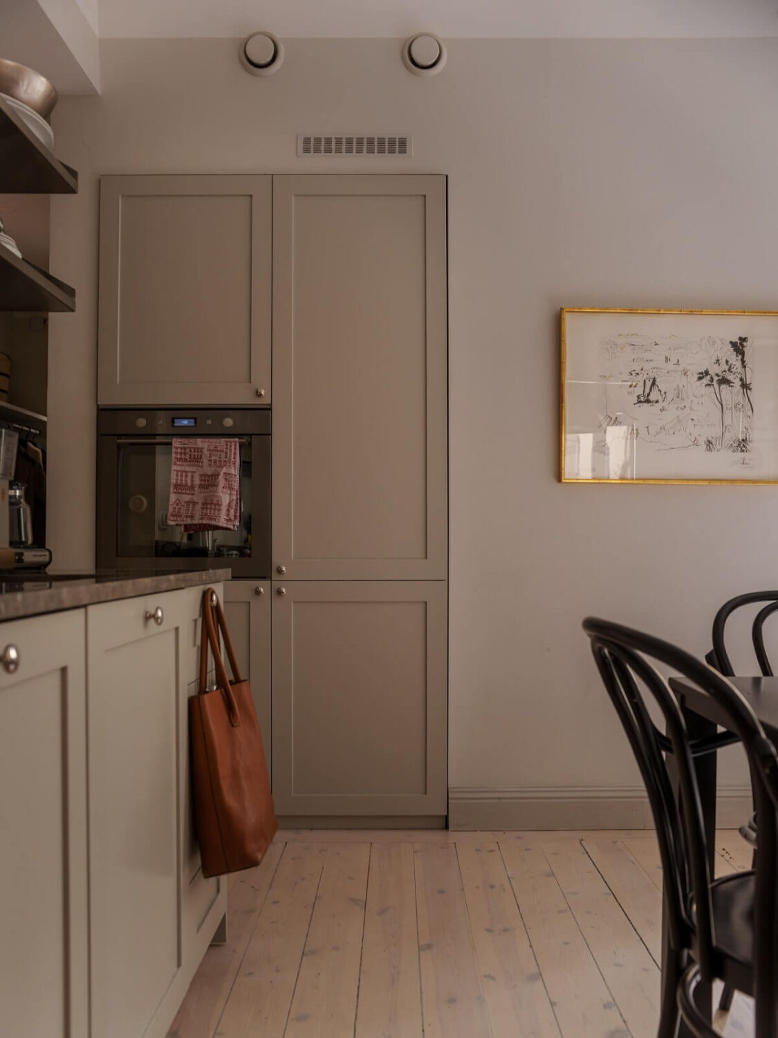 A Muted Color Palette in a Scandinavian Apartment 10 greige kitchen