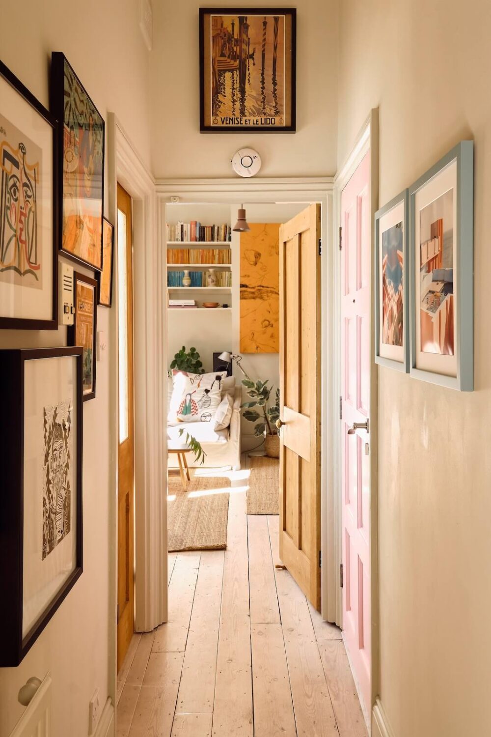 A Light London Apartment with a Yellow Kitchen 11 hallway with art