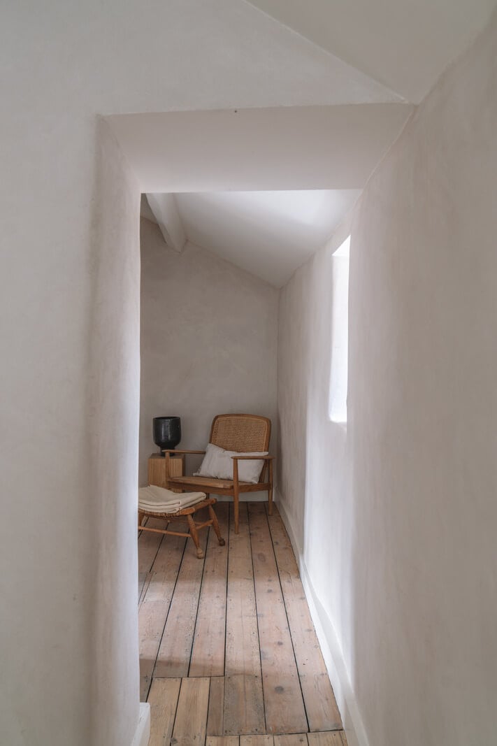 Contemporary Interiors in a Historic English House 20 hallway with bare wooden floorboards