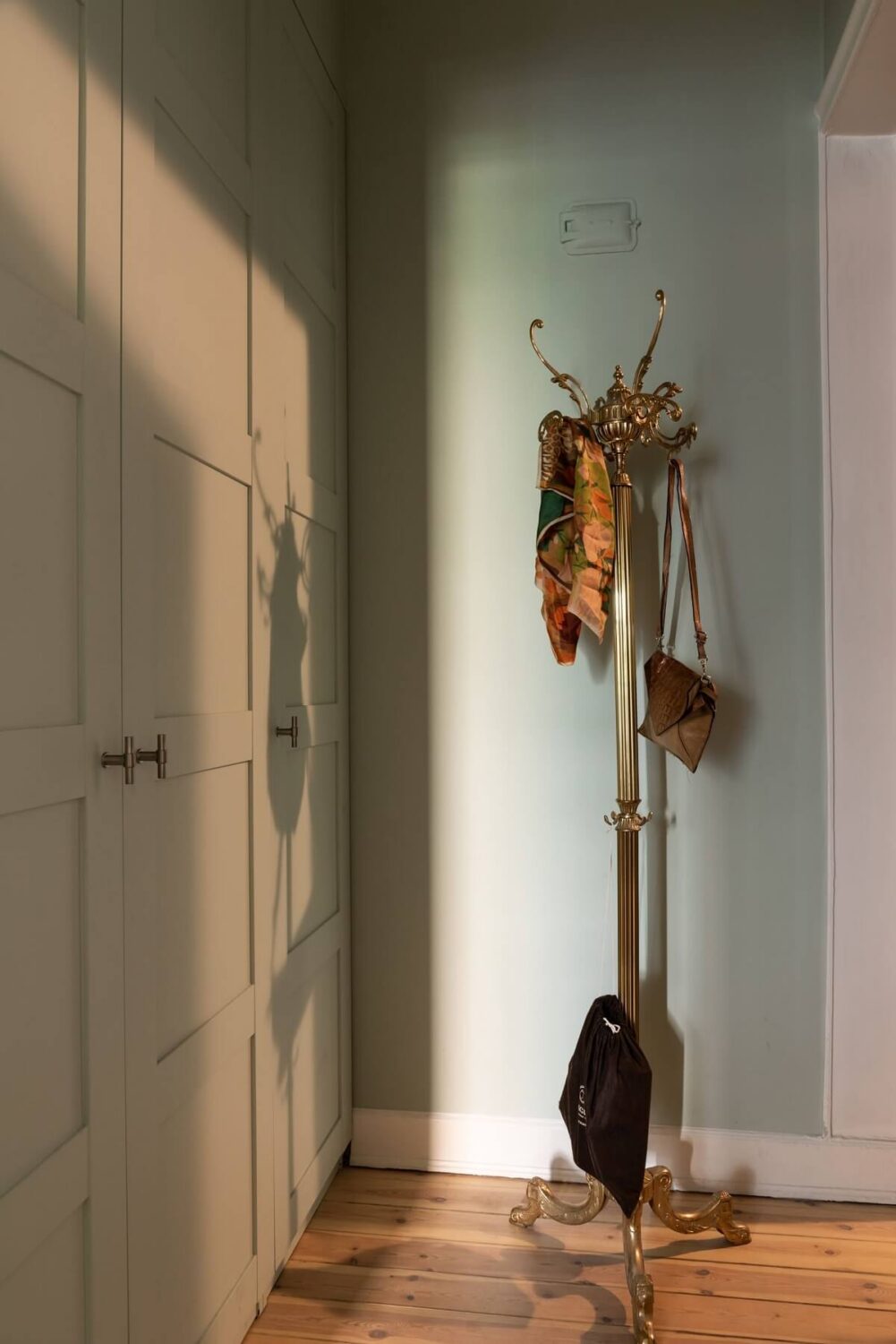 A Renovated Swedish Apartment with a Pink Bathroom 20 hallway with floor to ceiling cabinets