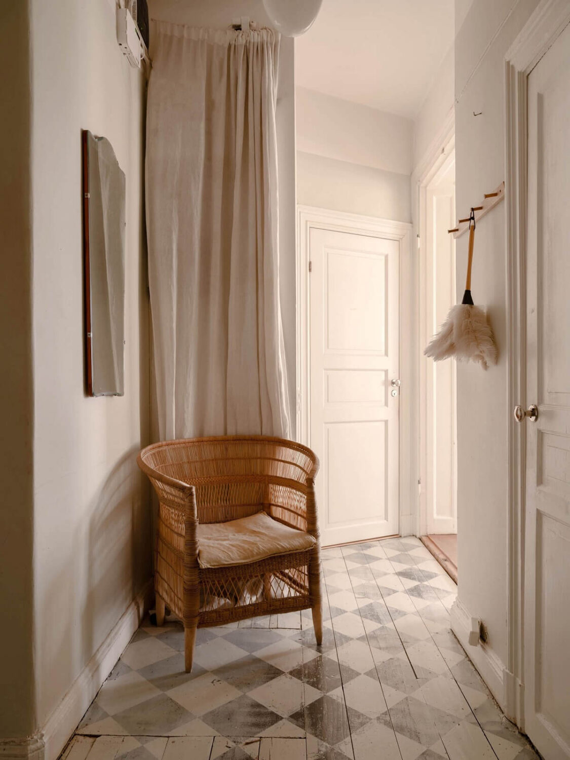 Elsa Billgren's Serene Stockholm Apartment is For Sale 24 hallway with painted checkerboard floor