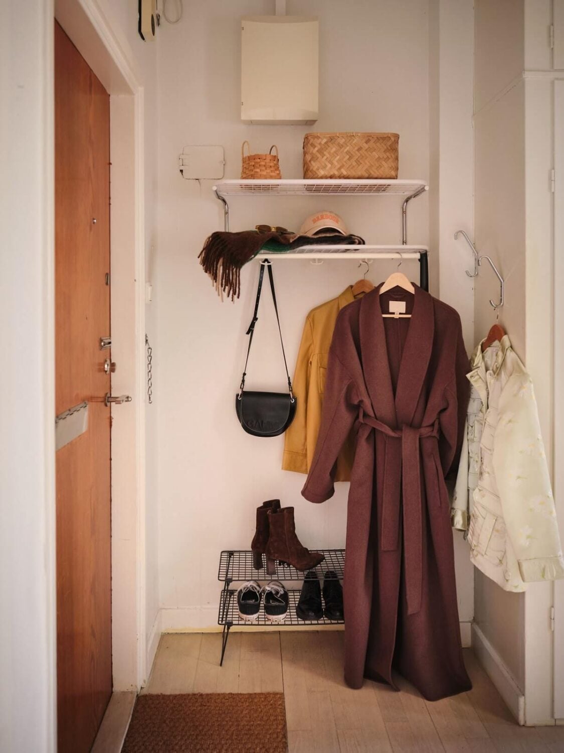 A Small Midcentury Apartment in Stockholm 13 hallway with shelves