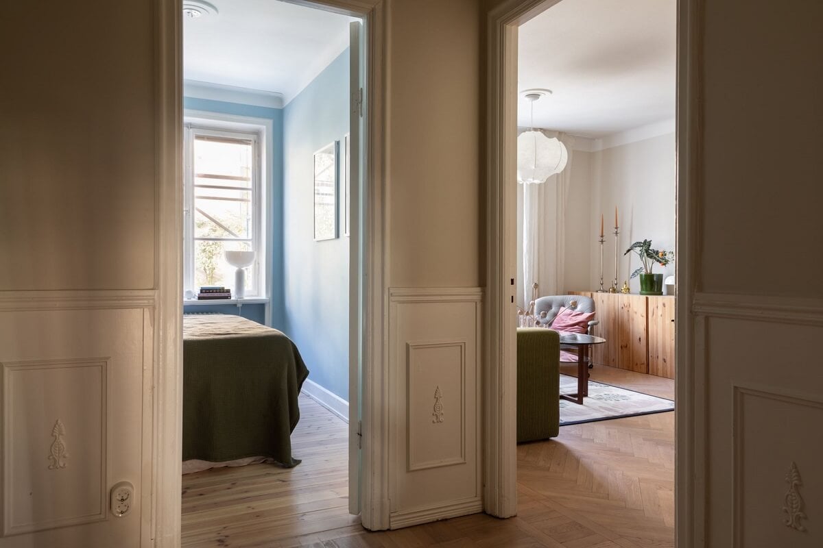 A Renovated Swedish Apartment with a Pink Bathroom 10 hallway with view of living room and bedroom