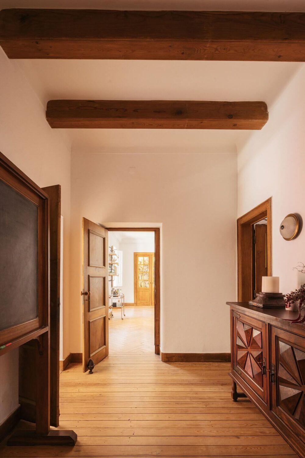 A Renovated Pink Manor House in Portugal 11 hallway with wooden beams