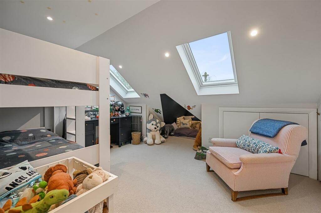 A London Family Home with Blue Color Accents 15 kids bedroom with slanted ceiling