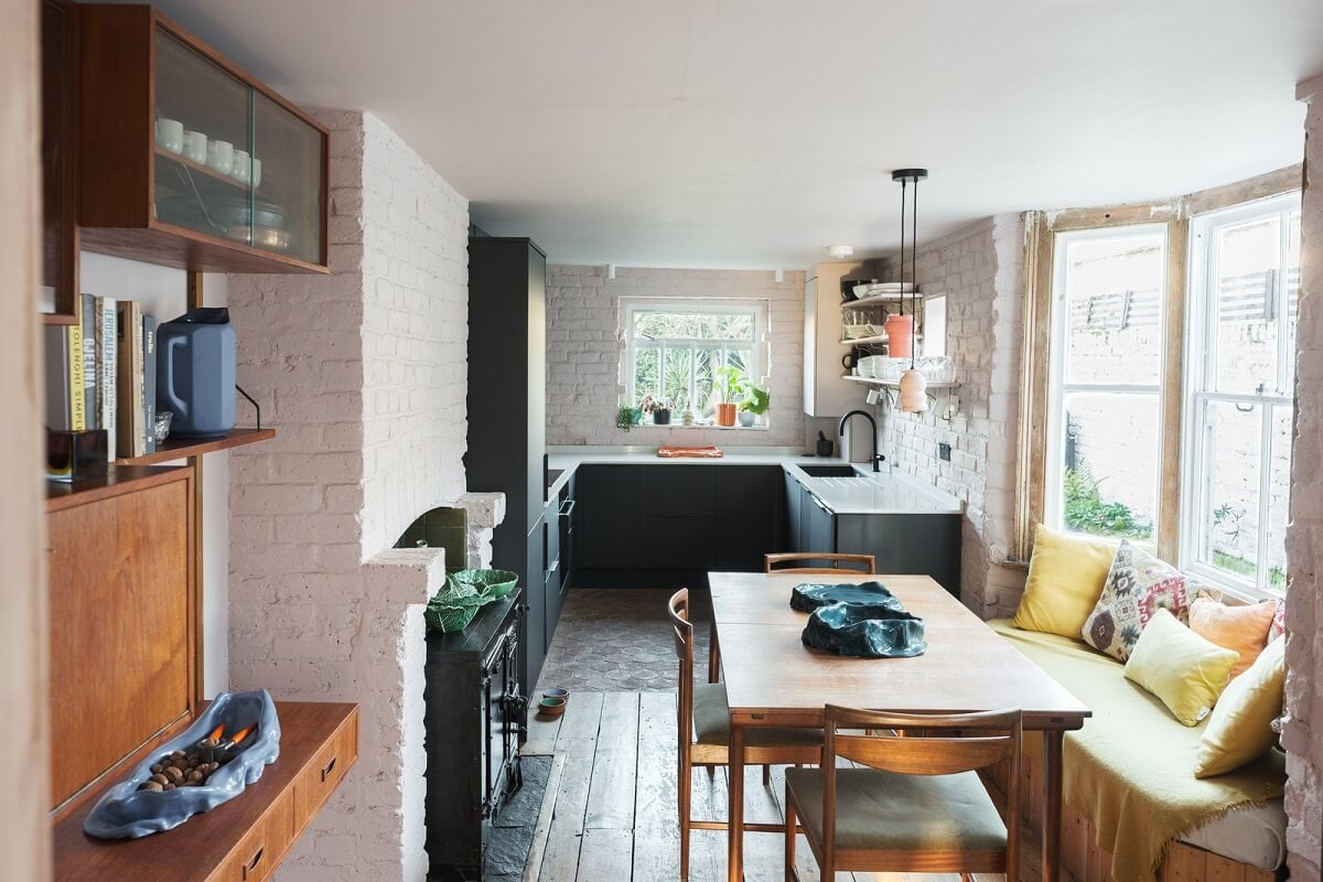 A London Home with Green Color Accents 6 kitchen and dining room with wooden floorboards