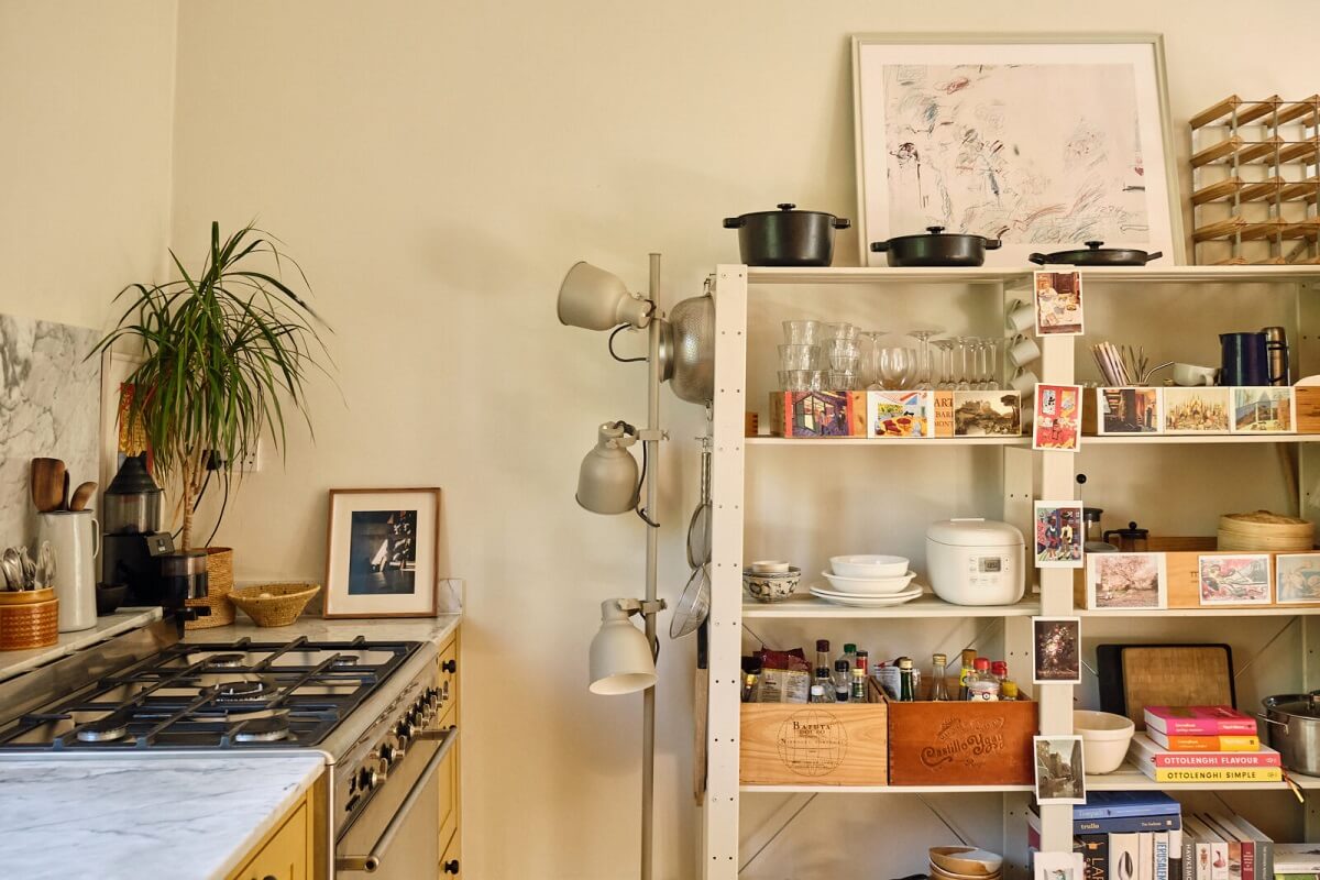 A Light London Apartment with a Yellow Kitchen 9 kitchen detail with open storage cabinet