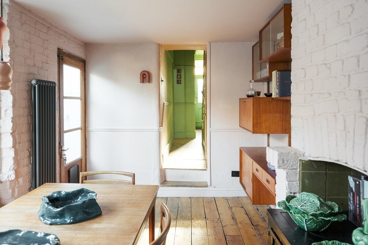 A London Home with Green Color Accents 9 kitchen dining area with wooden floor