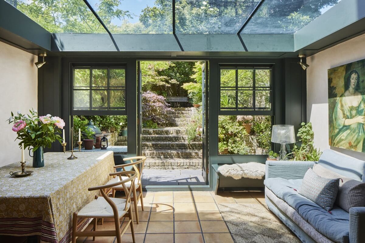 Inviting Colors in a Charming Georgian House in London 9 kitchen extension with stone floor and dining space