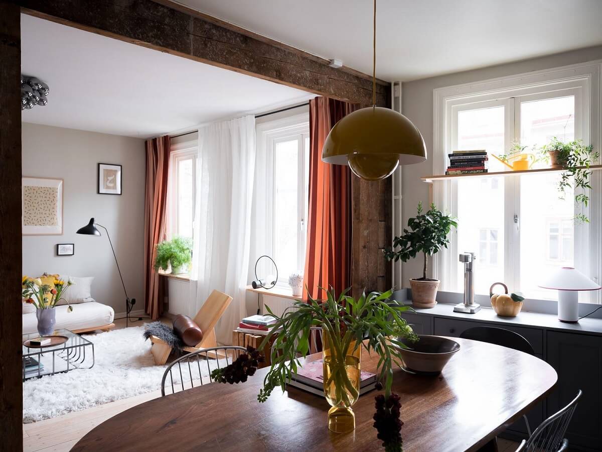 A Beautiful Color Palette in a Scandinavian Family Apartment 12 kitchen view into living room