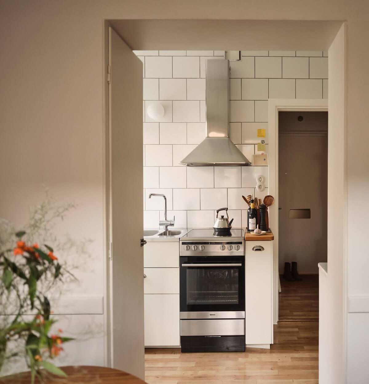 A Small Apartment with a Cozy Dining Nook 7 kitchen view