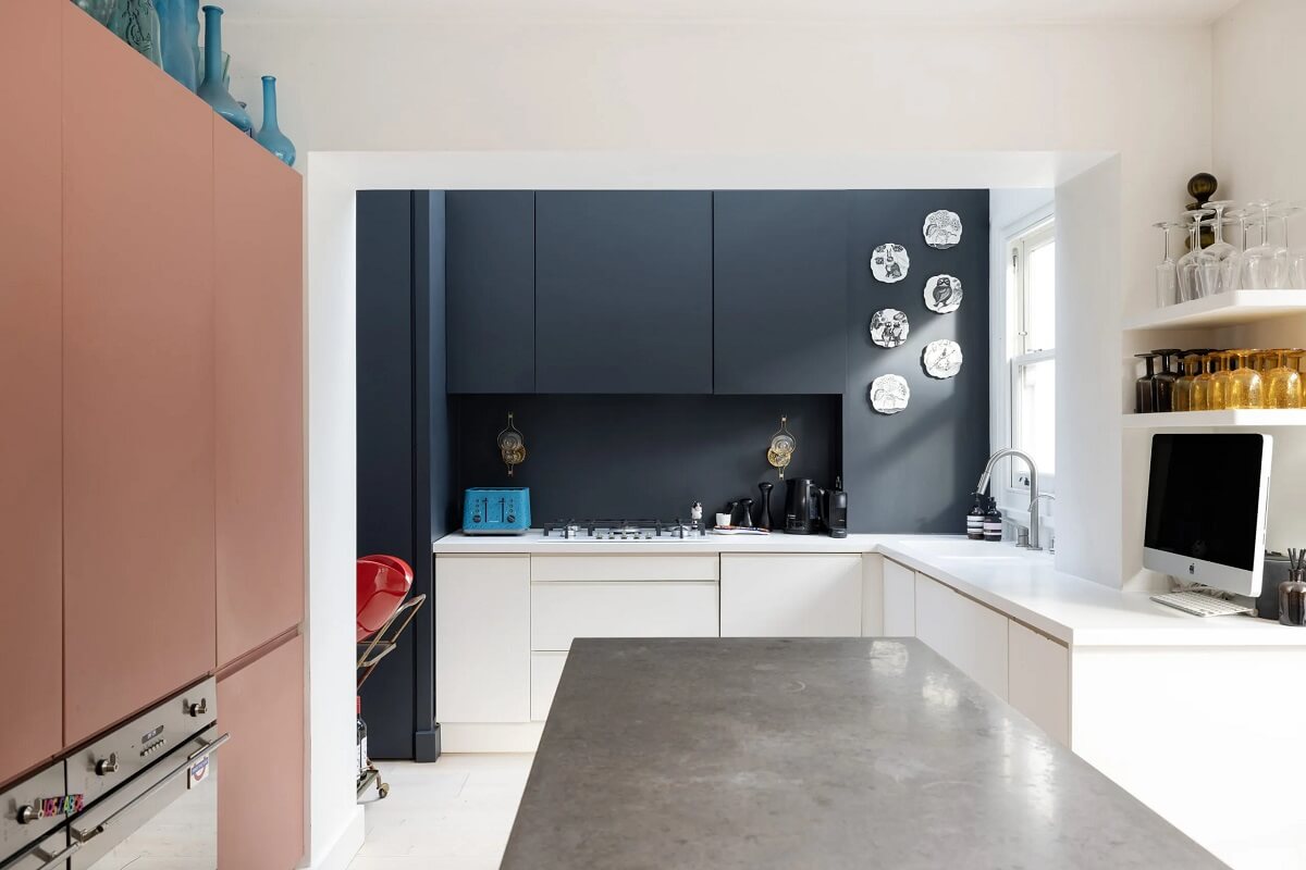 A Modern Apartment with Skylights in a Historic Building 4 kitchen with blue and pink cabinets