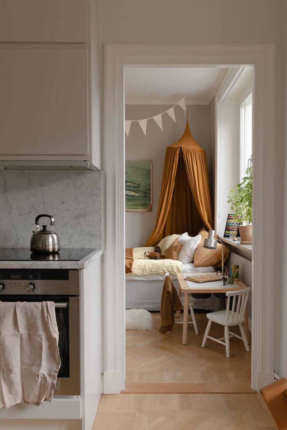 A Light Colored Swedish Apartment 15 kitchen with view to kids bedroom