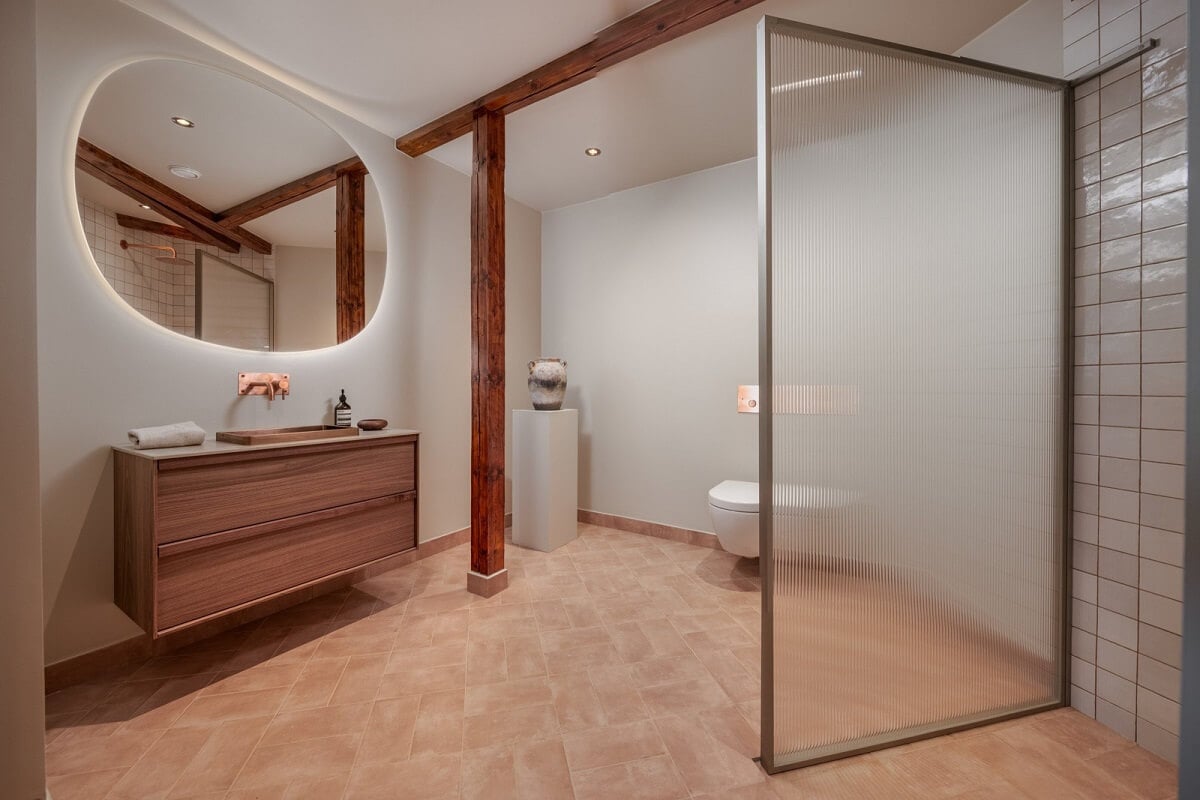 An Attic Apartment in Oslo with Exposed Wooden Beams 11 large bathroom with walk in shower