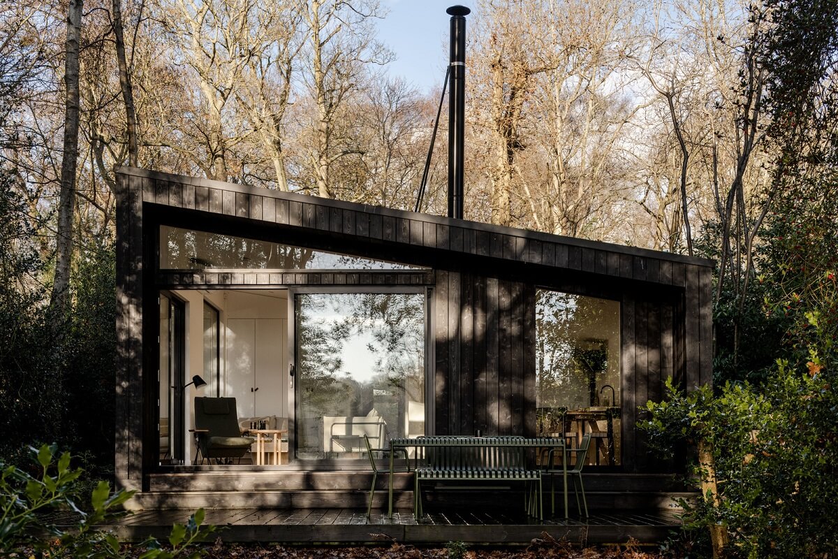 A Scandinavian-Inspired Cabin in the Woods 18 large windows black cabin