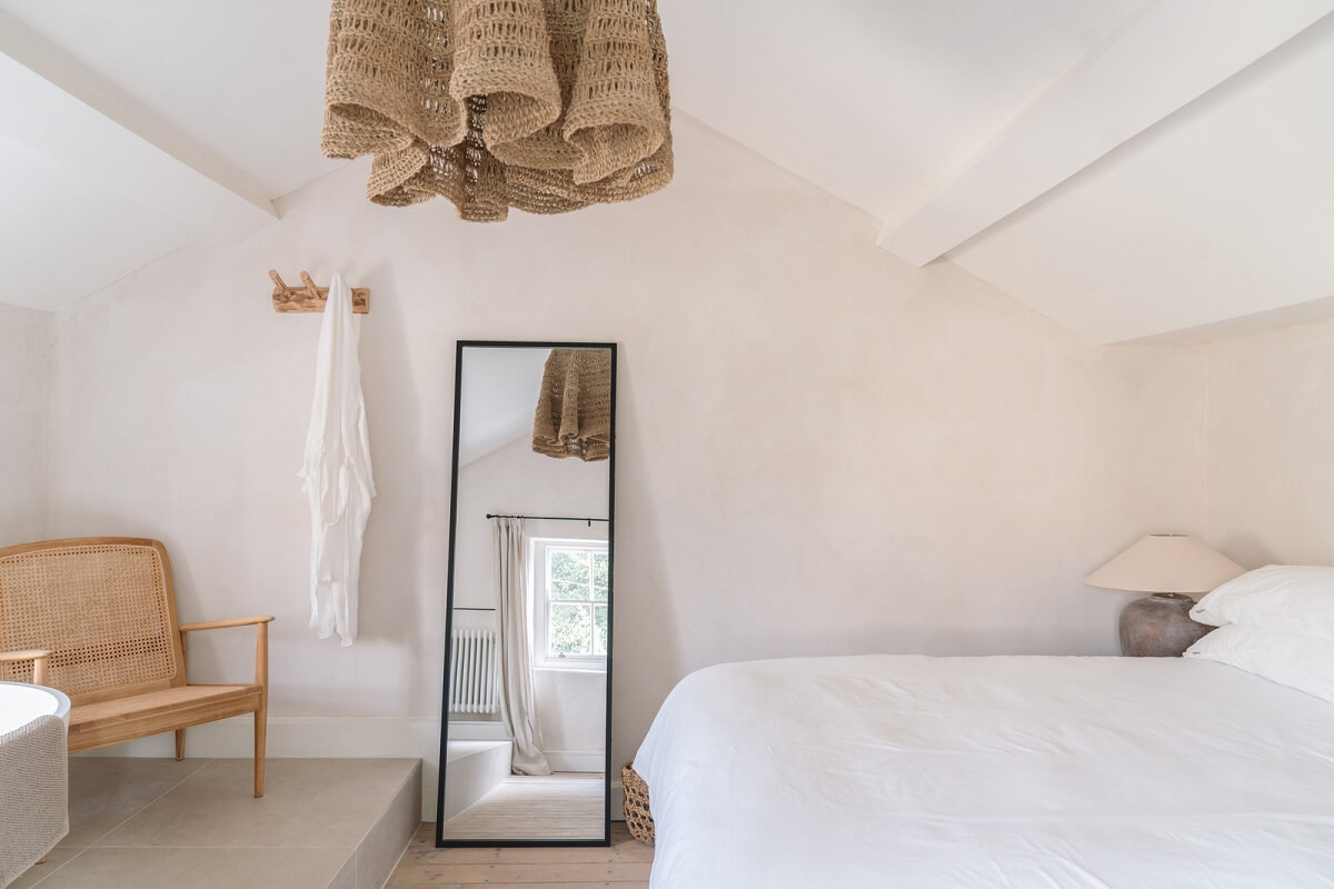 Contemporary Interiors in a Historic English House 12 light colored bedroom with pitched ceiling