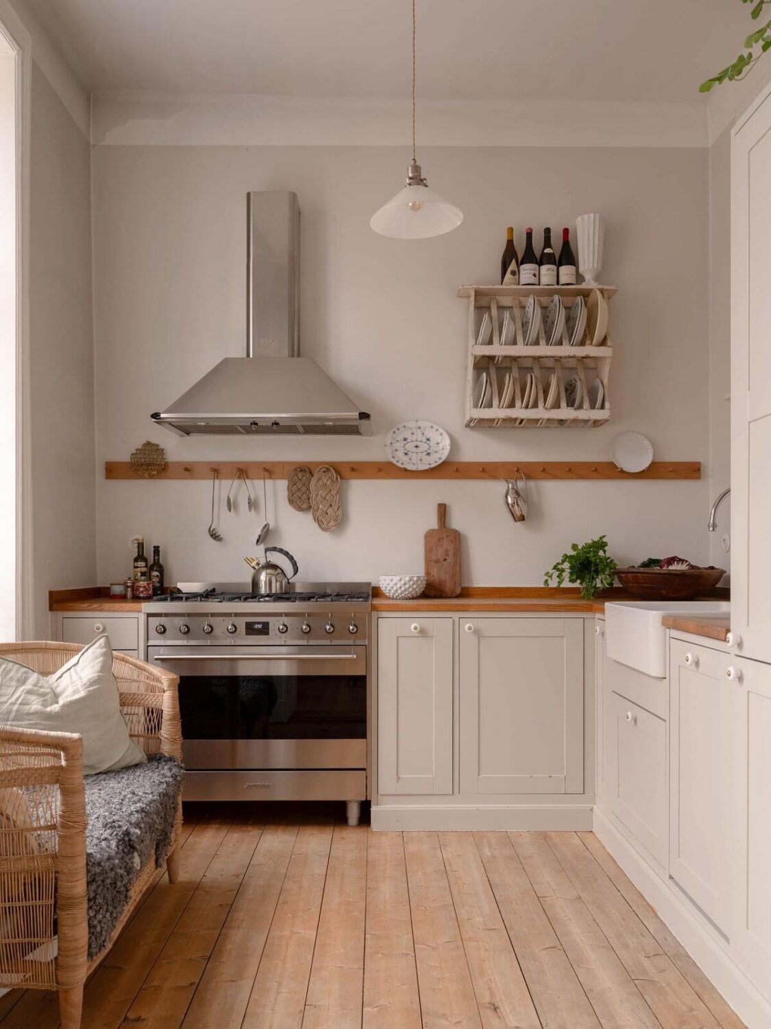 Elsa Billgren's Serene Stockholm Apartment is For Sale 10 light colored kitchen with bench and wooden floor