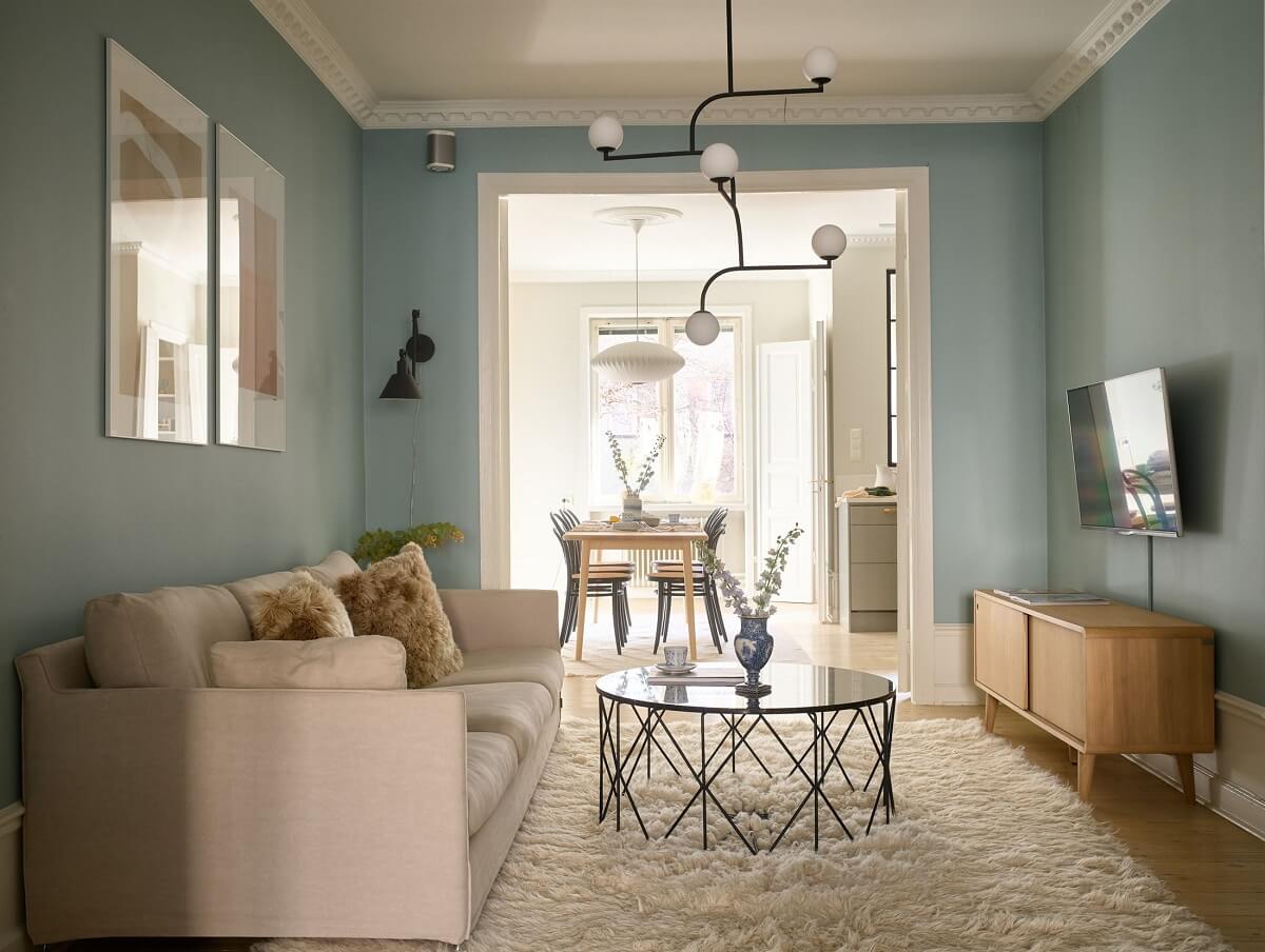 A Social Scandinavian Apartment with a Light Blue Living Room 9 light colored living room with blue walls