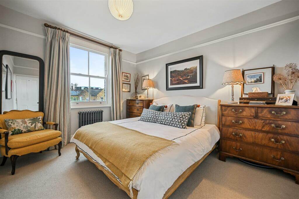 A London Family Home with Blue Color Accents 12 light gray bedroom with yellow color accent