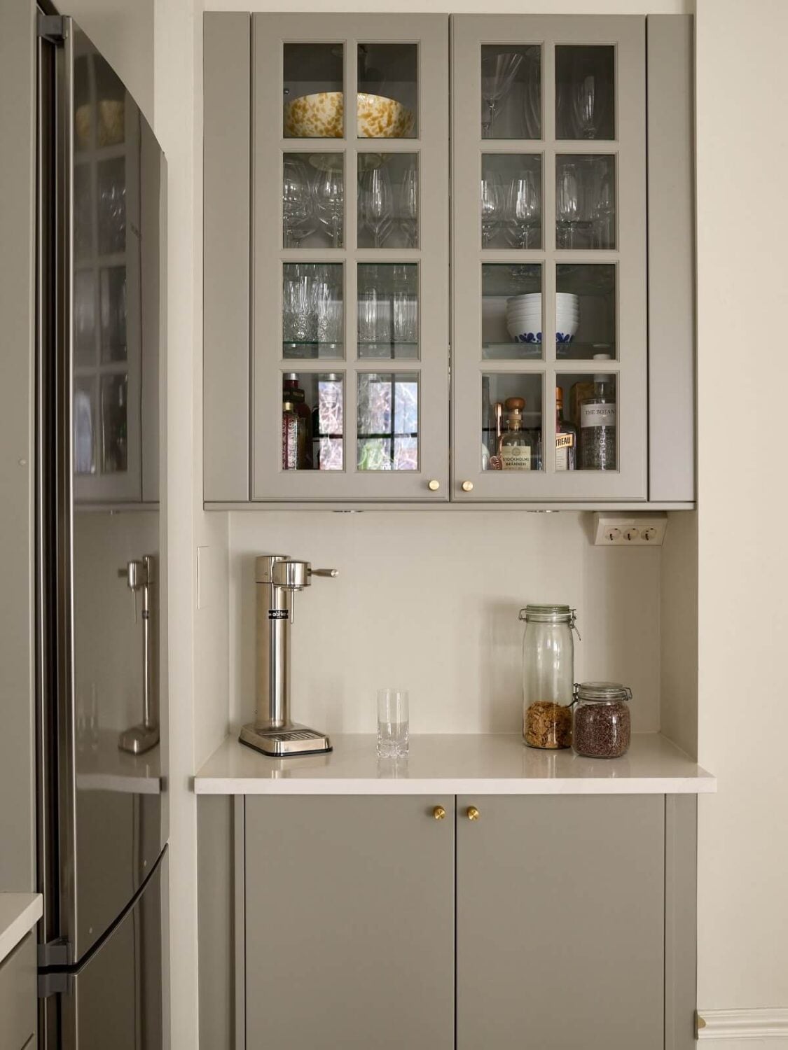 A Social Scandinavian Apartment with a Light Blue Living Room 7 light gray kitchen cabinets