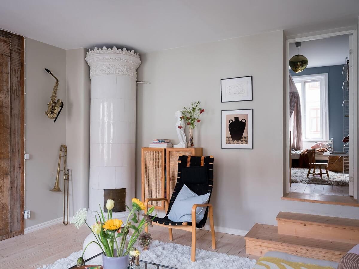 A Beautiful Color Palette in a Scandinavian Family Apartment 22 light gray living room with round fireplace
