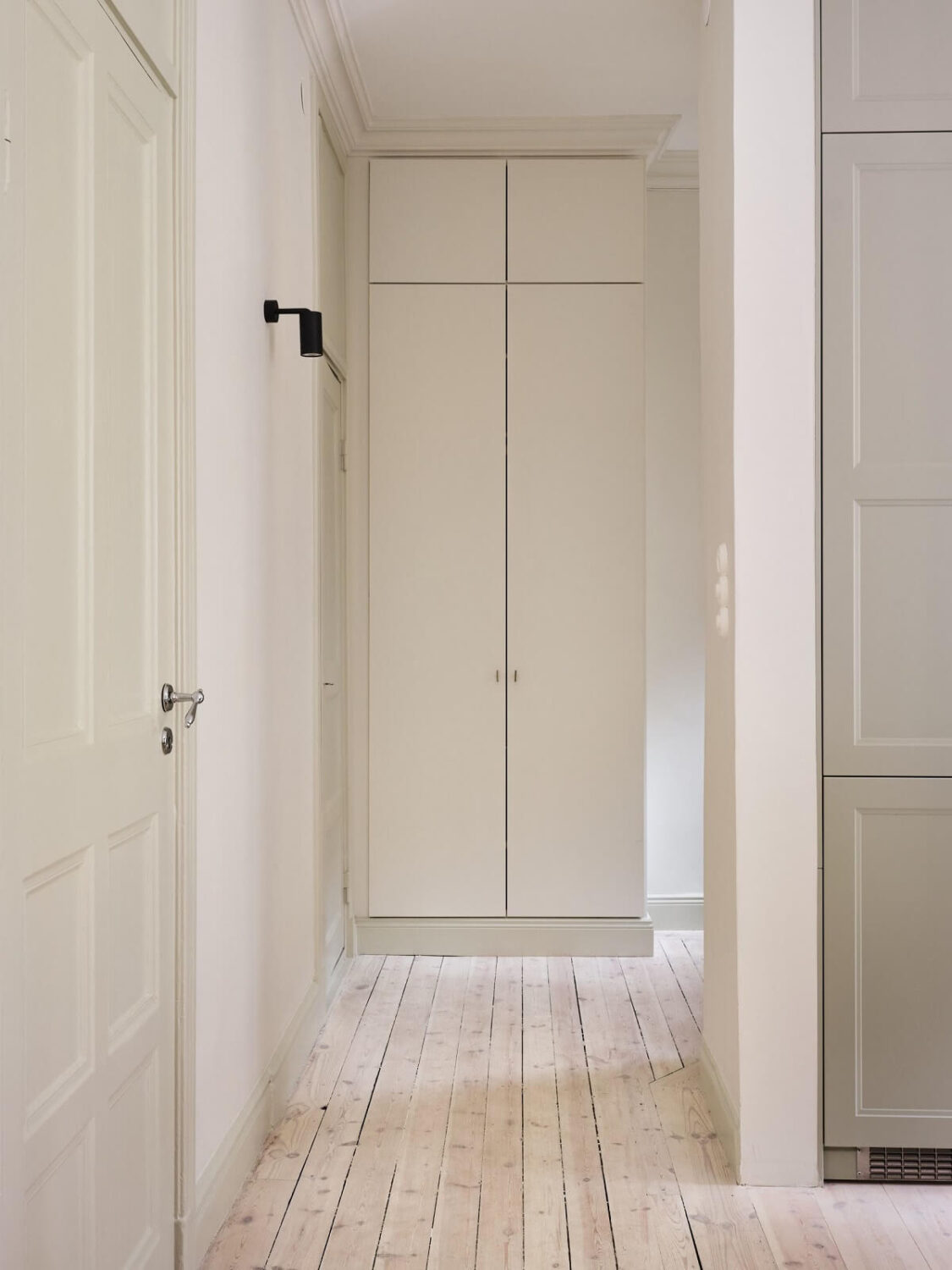A Light Filled Duplex Apartment in Sweden 28 light hallway with wooden floor