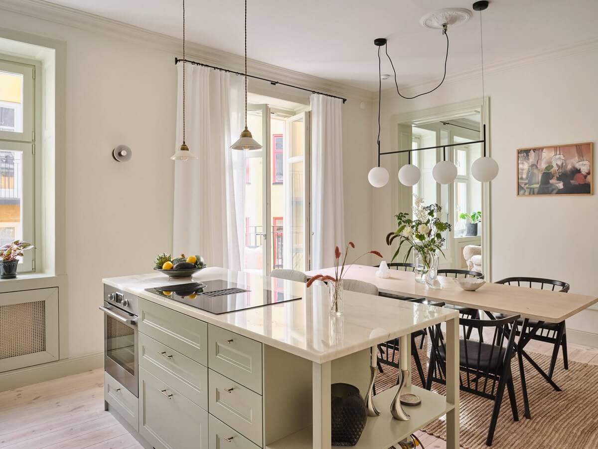 A Light Filled Duplex Apartment in Sweden 6 light kitchen dining room with island