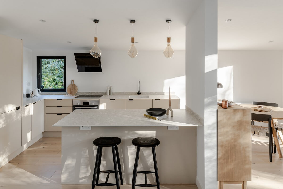 A Scandinavian-Inspired Cabin in the Woods 7 light modern kitchen with breakfast bar