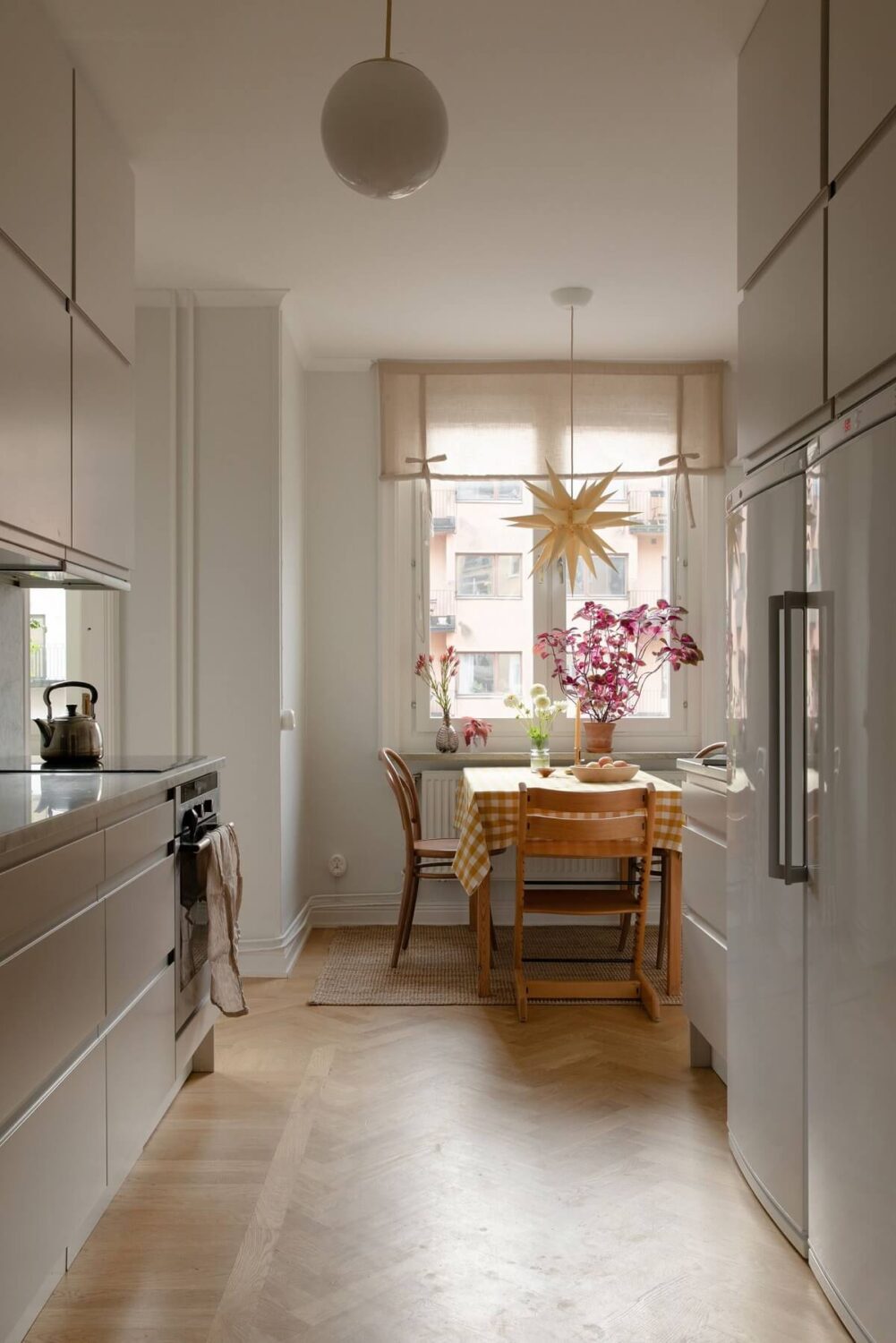 A Light Colored Swedish Apartment 12 light modern kitchen with dining table