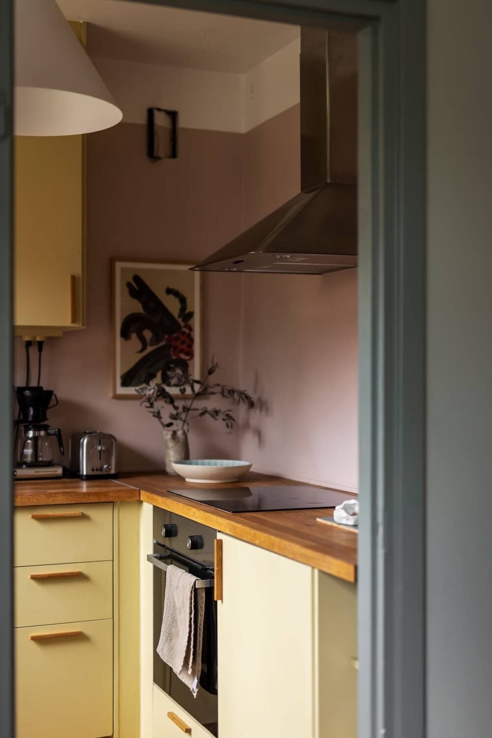 Yellow Kitchen Design Ideas (with Paint Colors) 27 light pink walls and yellow kitchen cabinets