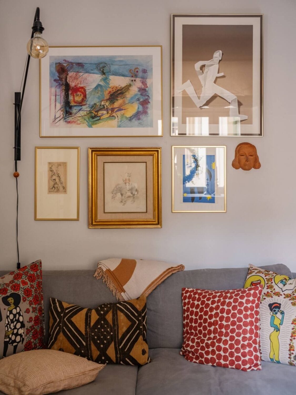 A Muted Color Palette in a Scandinavian Apartment 3 living room art detail