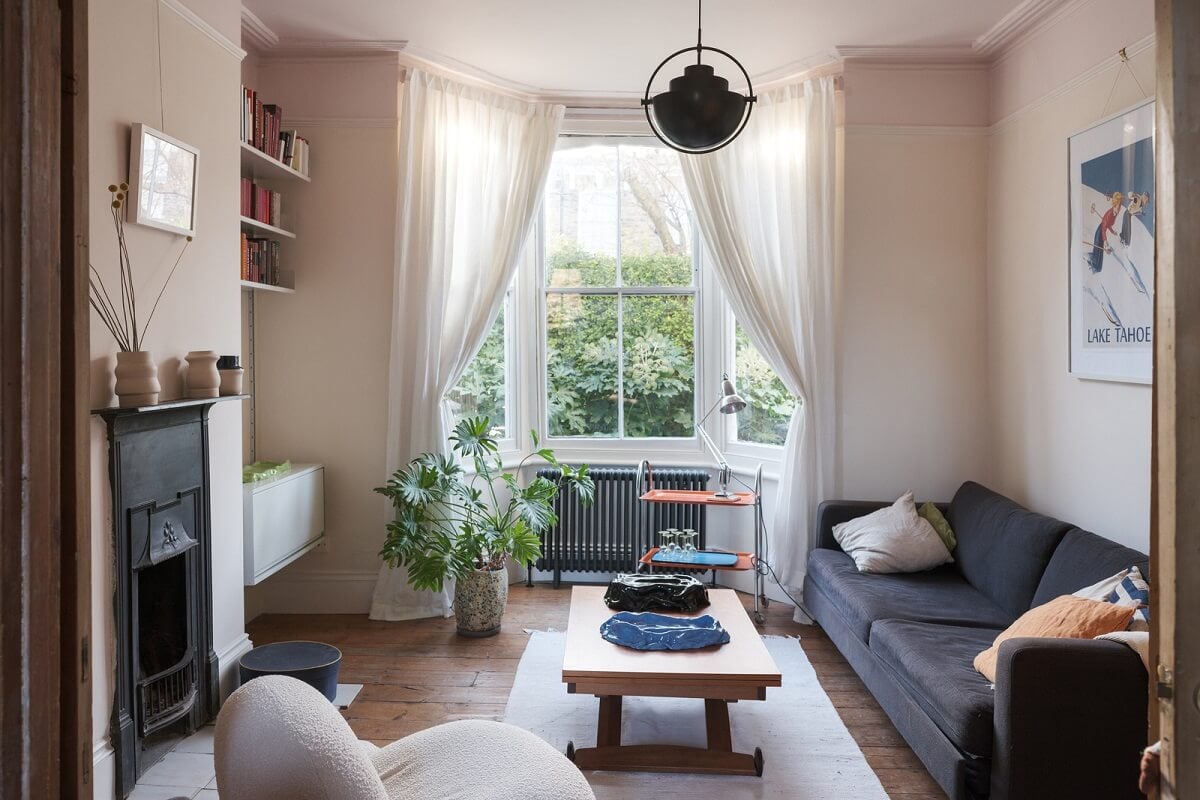 living room with bay window and black fireplace