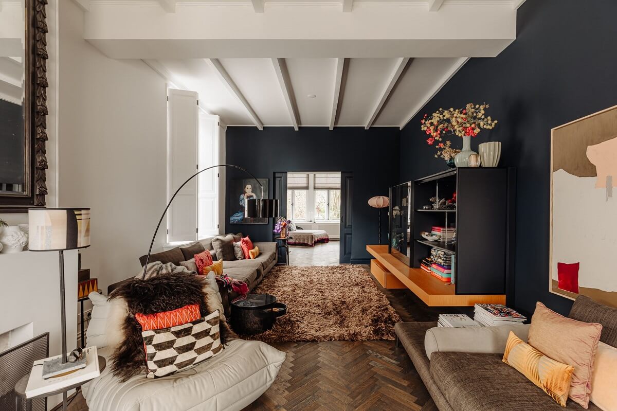 A Beautifully Renovated Dike House in The Netherlands 11 living room with dark gray walls