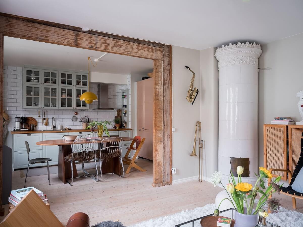 A Beautiful Color Palette in a Scandinavian Family Apartment 19 living room with fireplace and exposed beams