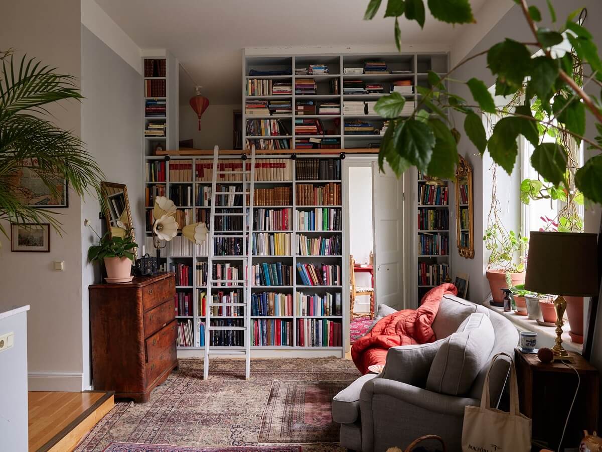 living room with floor to ceiling bookcases