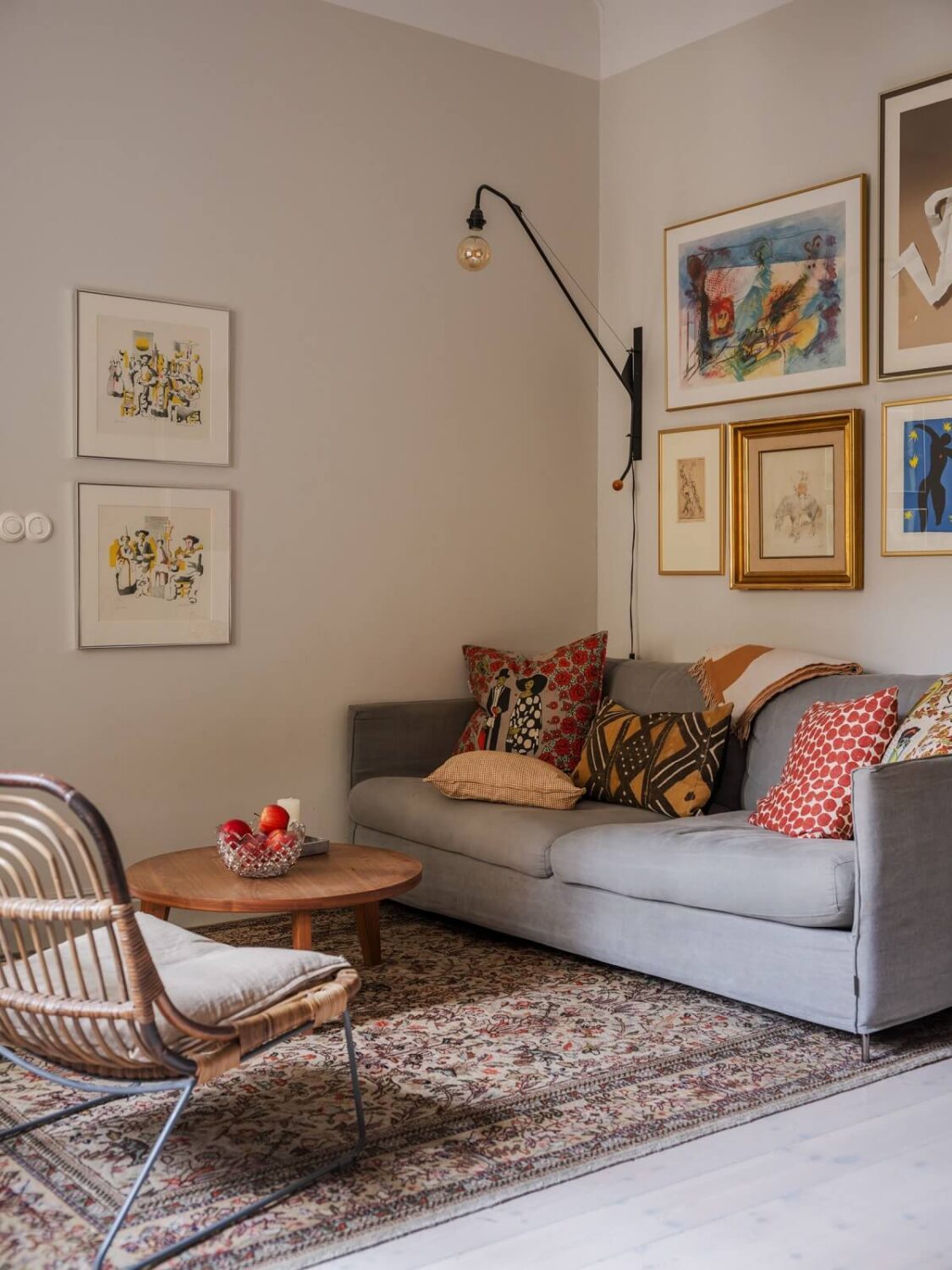 A Muted Color Palette in a Scandinavian Apartment 1 living room with light gray sofa art and beige walls