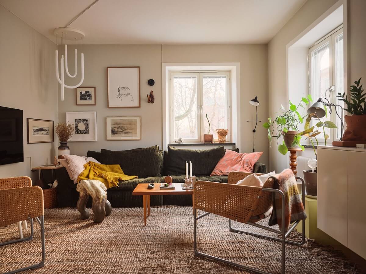 A Small Apartment with a Cozy Dining Nook 1 living room with light walls and green sofa