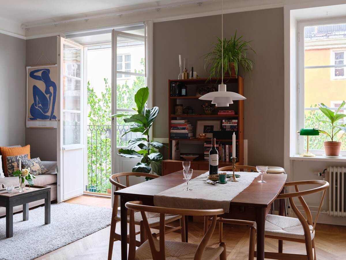 A Small Gray Apartment with Industrial Glass Walls 6 living room with open kitchen and gray walls