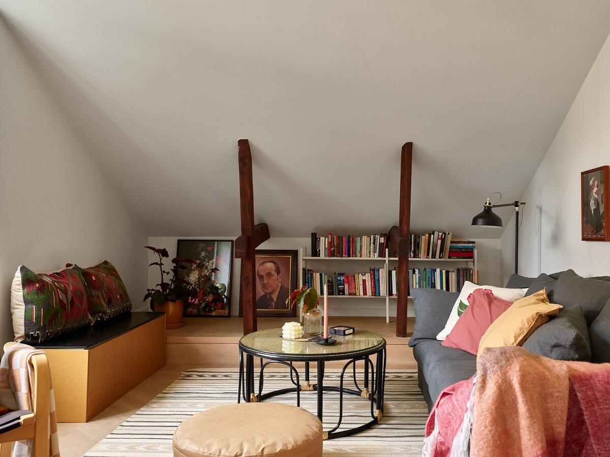 A Small Attic Apartment with a Golden Yellow Bedroom 1 living room with slanted ceiling