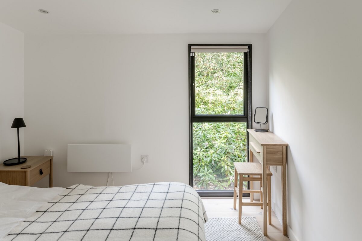 A Scandinavian-Inspired Cabin in the Woods 14 minimalistic white bedroom
