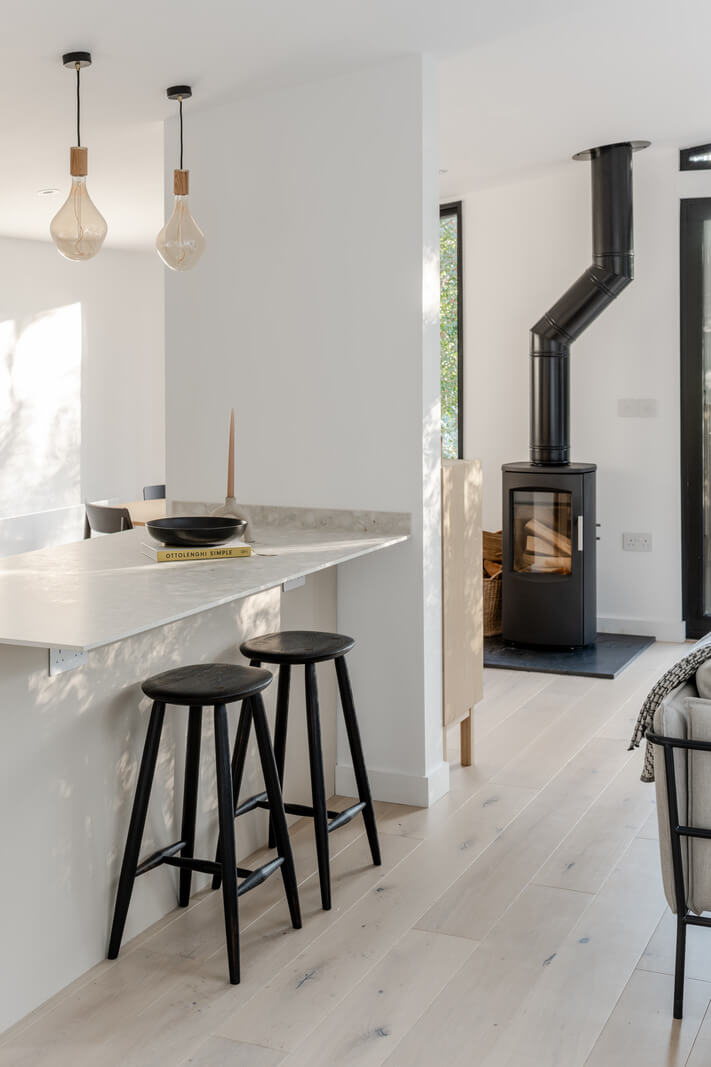 A Scandinavian-Inspired Cabin in the Woods 9 modern kitchen bar cabin