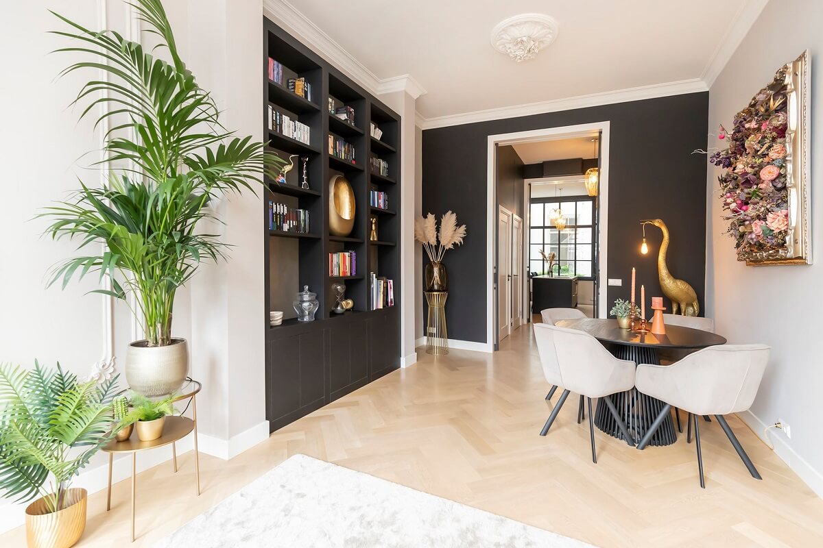 A Renovated Canal House with a Separate Pink Studio Apartment 6 modern living room with round table and bookshelves
