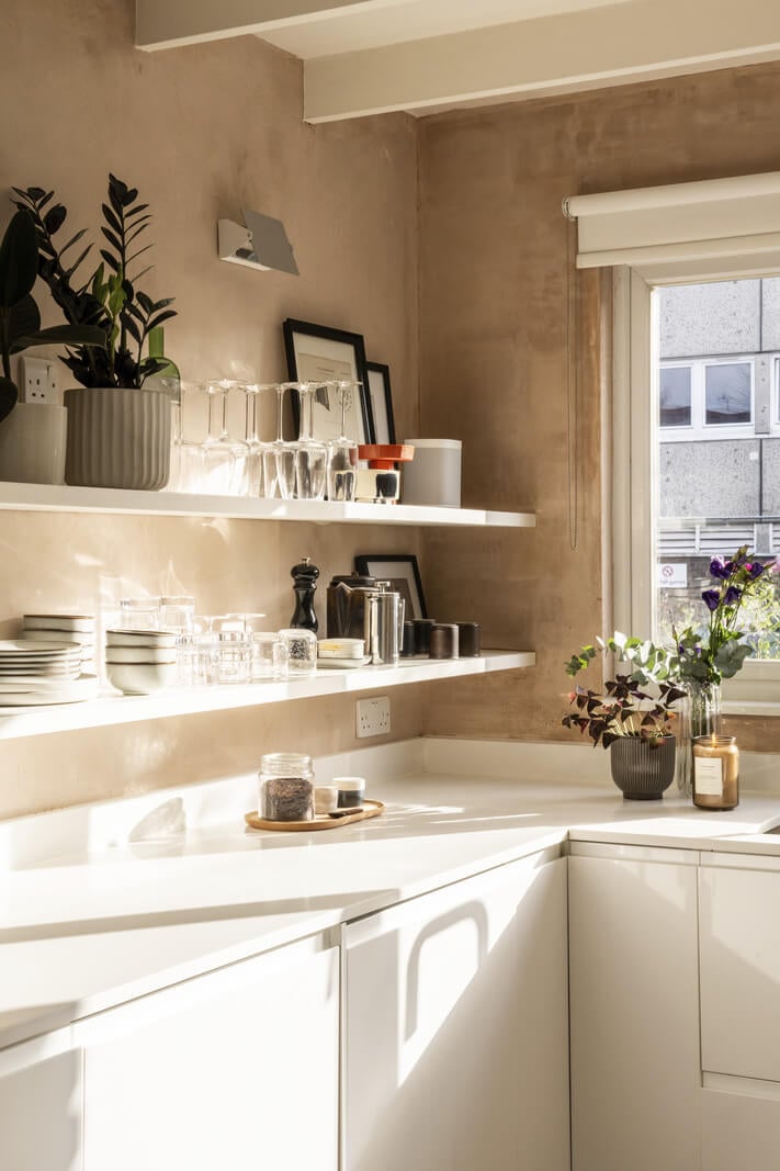 A Modern London Home with Plaster Walls 9 modern white kitchen with shelves