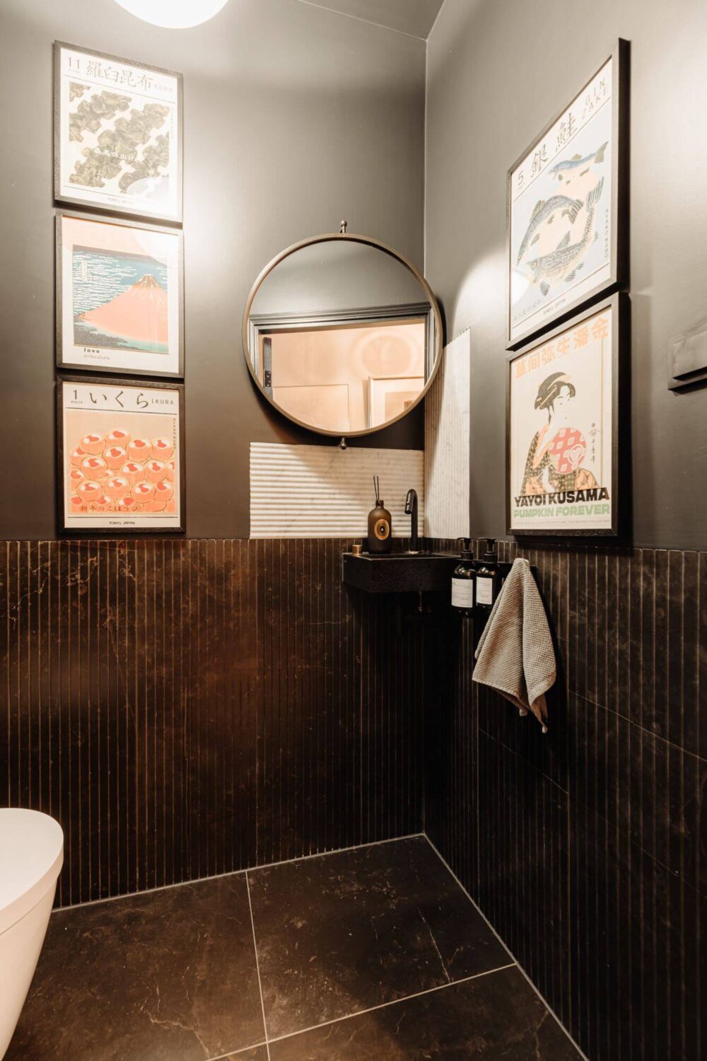 A Beautifully Renovated Dike House in The Netherlands 6 moody bathroom with round mirror