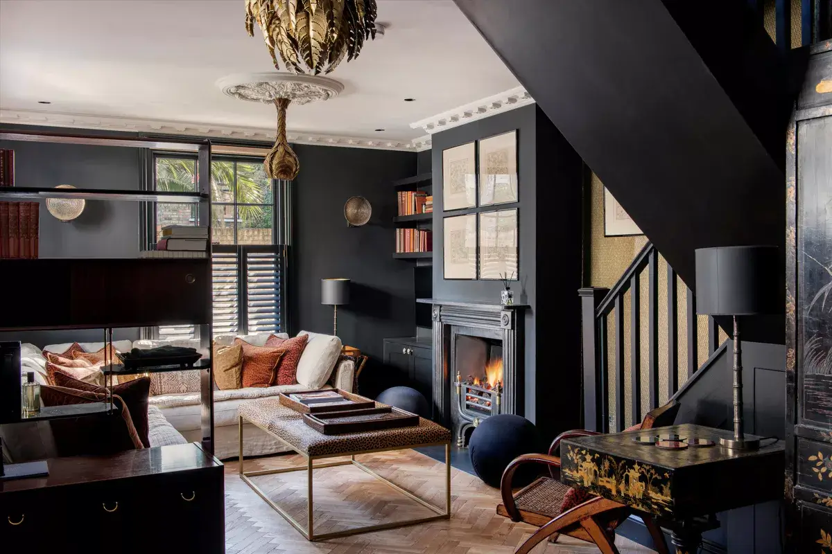 A Stylish Renovated House in Notting Hill 2 moody modern living room with fireplace